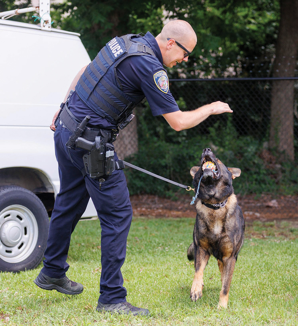 Training with positive reinforcement includes praise and K-9 Dash's favorite ball as a reward.