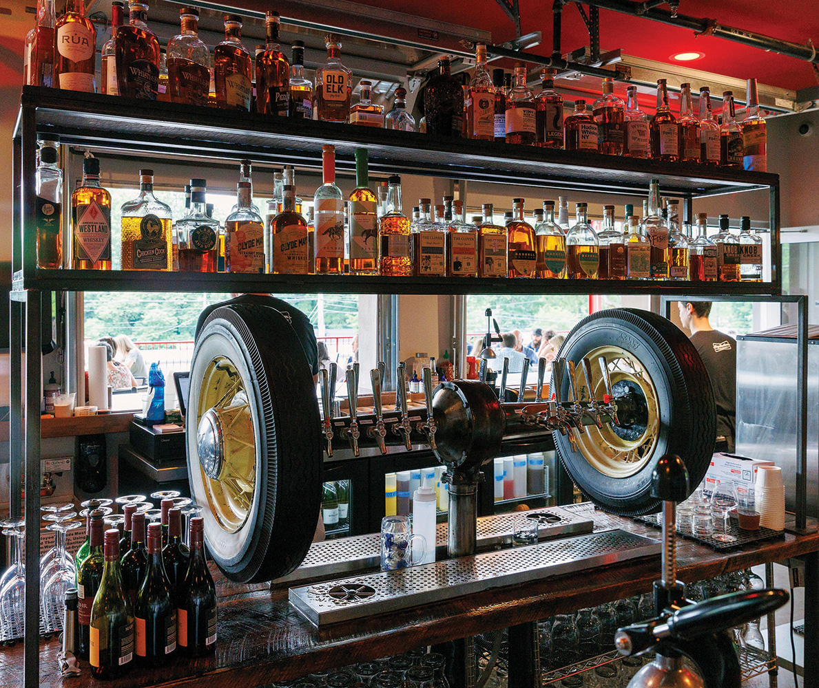 A custom fabricated Model A axle serves as a multi-tap beer dispenser.