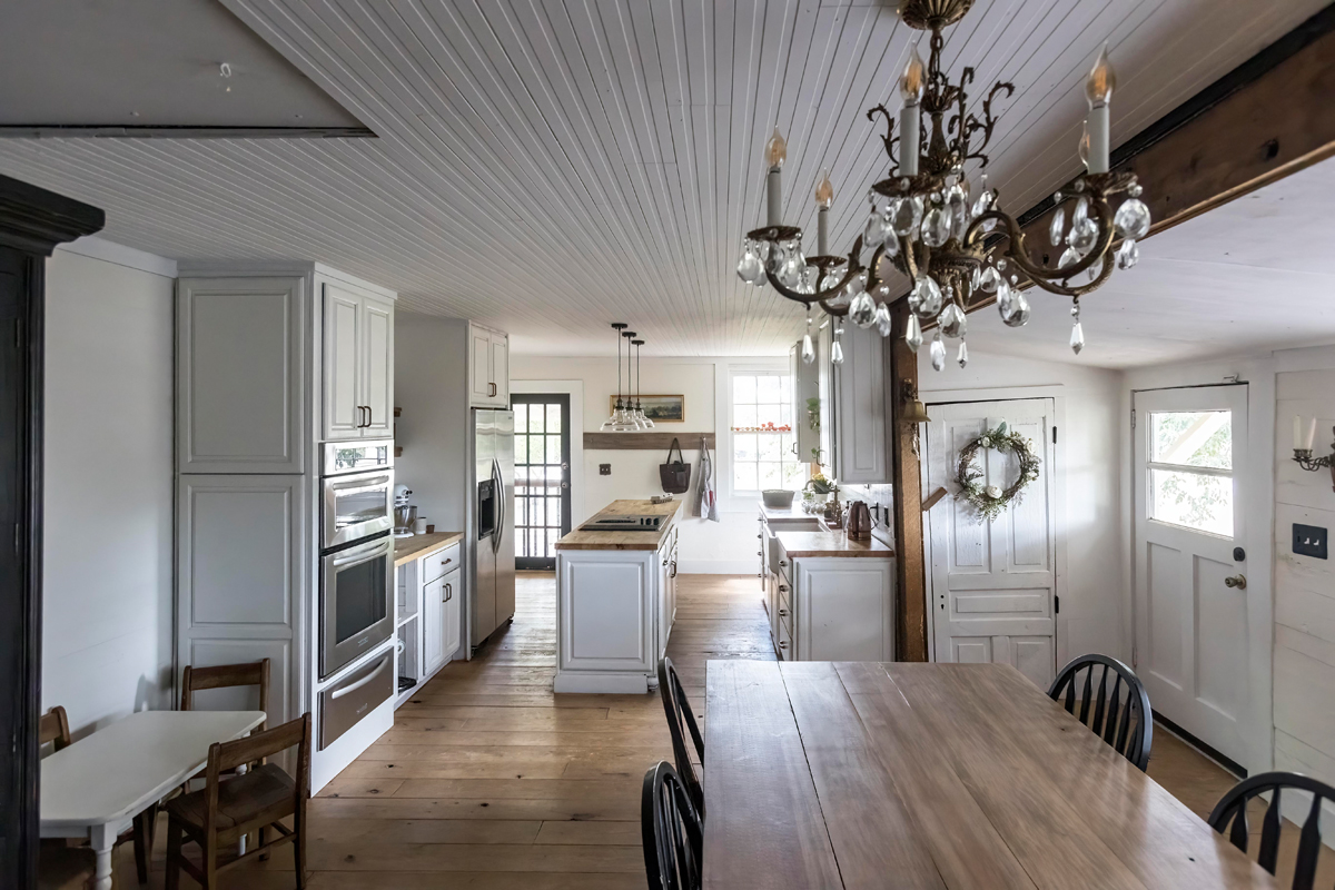 Corey built the family's farmhouse table. The charming farmhouse kitchen is stocked with tomatoes from the garden and green apples and pecans from the trees in the backyard.